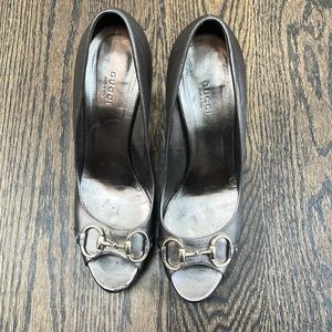 Gucci peep toe platforms with buckle.